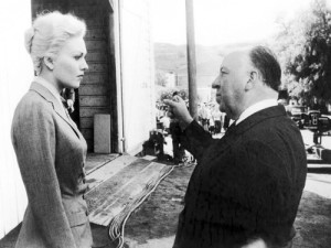 Alfred Hitchcock and his second choice for the role Kim Novak (looking thrilled).